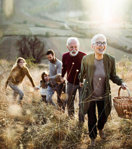 happy family walking in a field