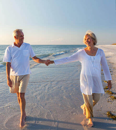 couple enjoying a walk at the beach