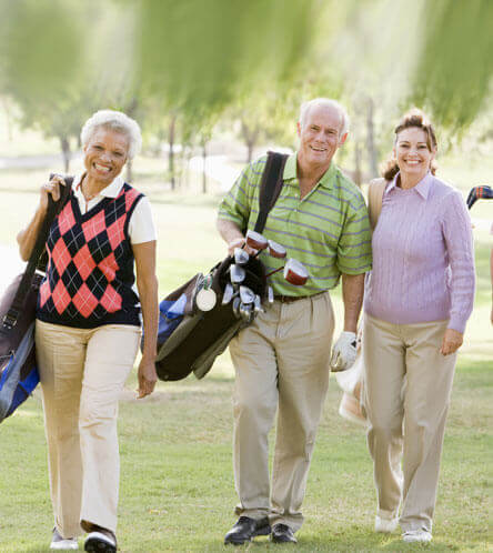 man and women coming back from playing golf