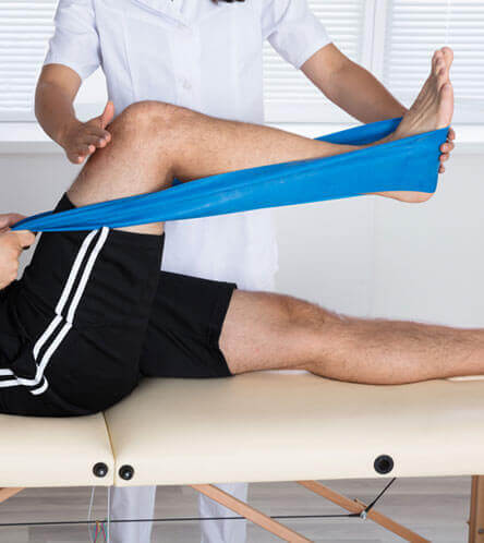 man undergoing orthopedic physical therapy
