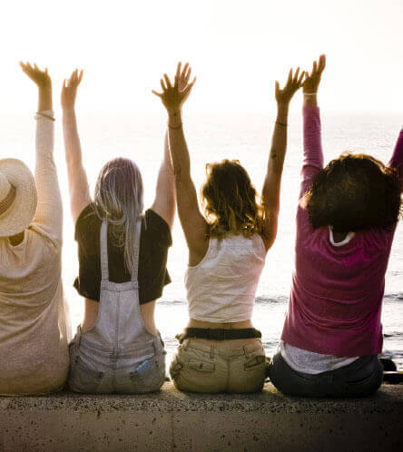 happy woman raising arms